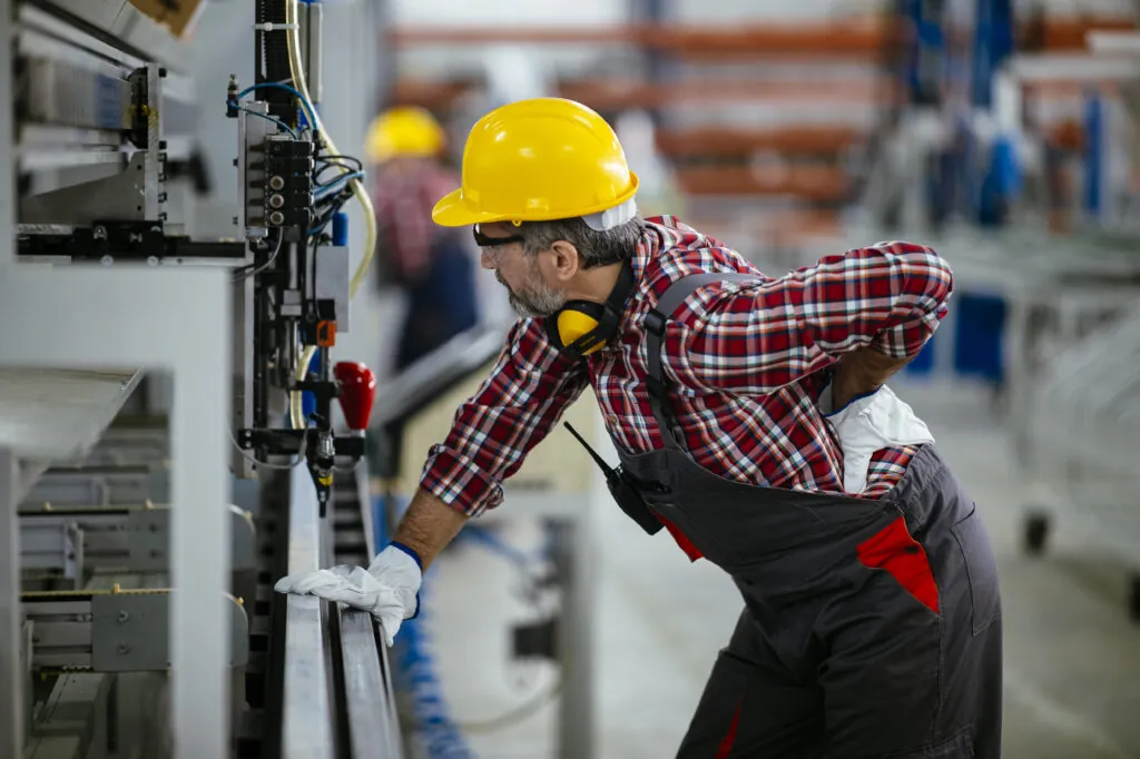 Factory worker with painful back injury.