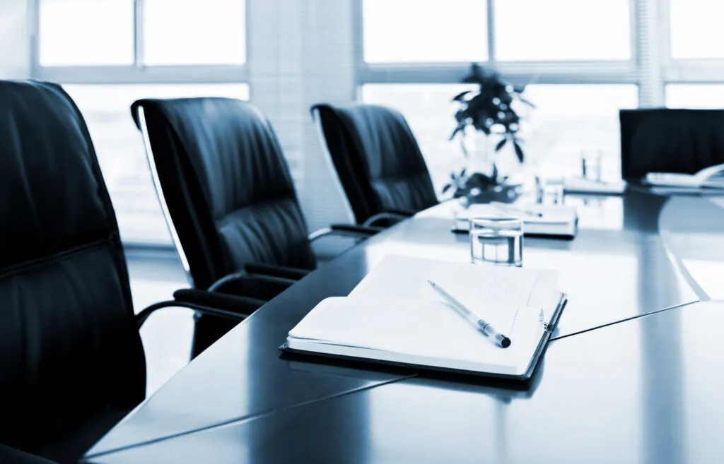 Notebook with pen in meeting room